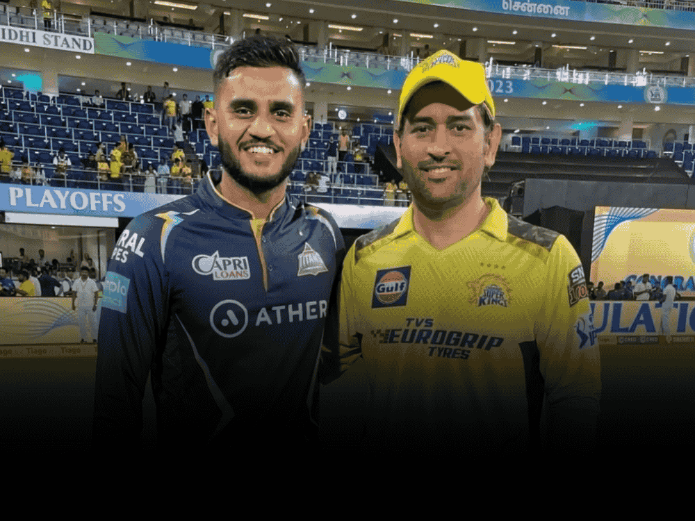 Poster of Urvil Patel, who was signed by CSK for IPL 2025, posing during an IPL match, wearing Gujarat Titans jersey on the left side, and standing beside MS Dhoni in CSK jersey on the right.