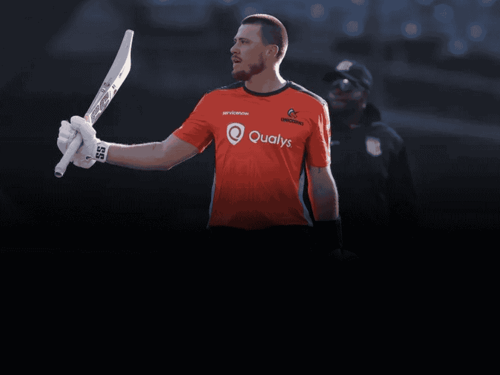 Finn Allen in San Francisco Unicorns jersey raising his bat to the crowd during MLC's match after breaking Chris Gayle’s record by hitting 19 sixes in a single T20 innings.