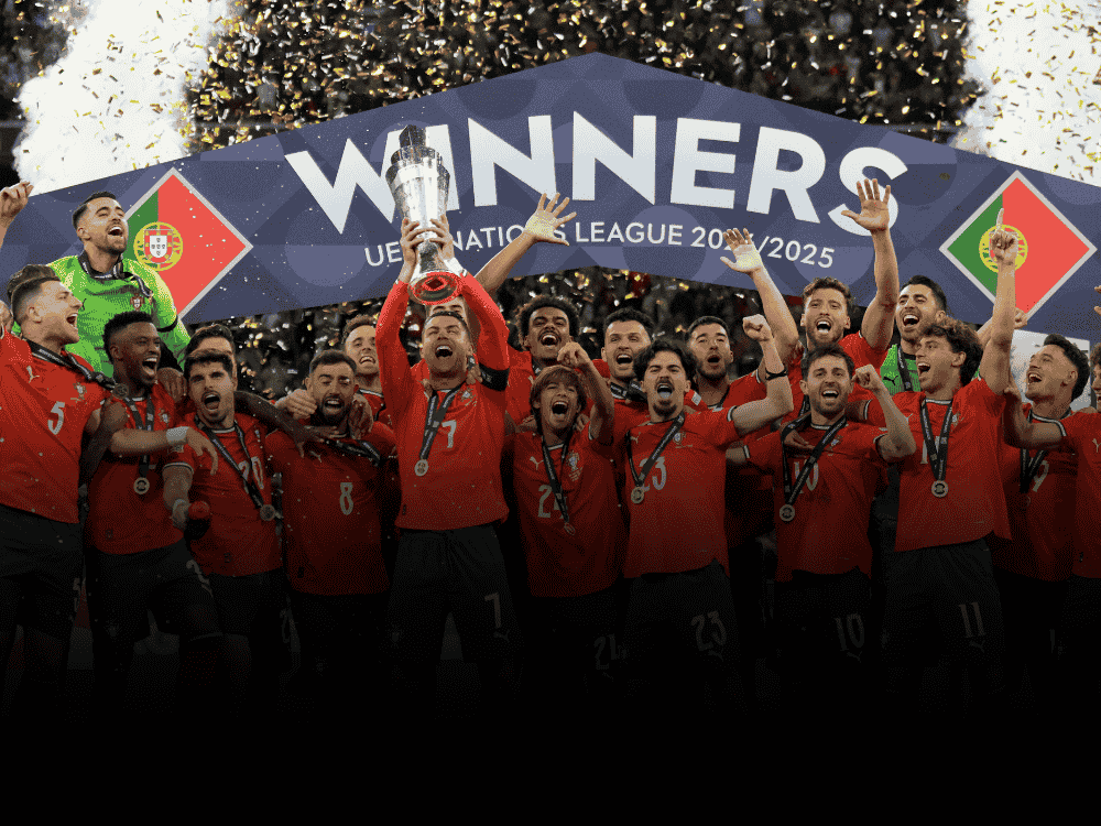 Portugal players celebrating with the UEFA Nations League trophy after defeating Spain in the final match.