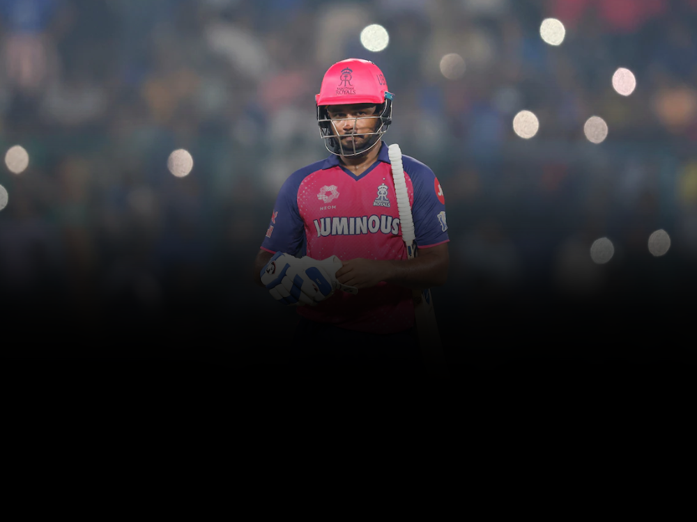 Image shows Sanju Samson in Rajasthan Royals jersey walking out to bat, a player who might be traded to CSK for the 2026 IPL season.